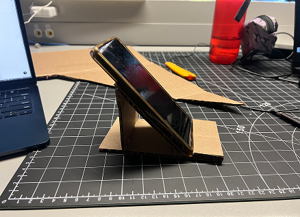 The final prototype with the phone in place. I tested it out with different phone sizes to ensure it would fit various models.